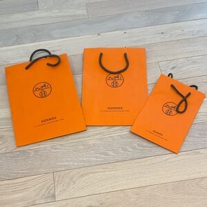 Hermès Bright Orange Paper Shopping Bags with Black Rope Handles